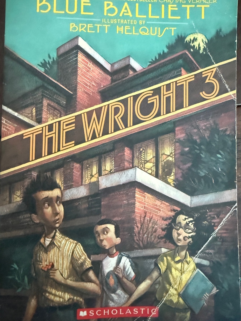The Wright 3 Illustrated Book Cover in Teal and Brown - Scholastic